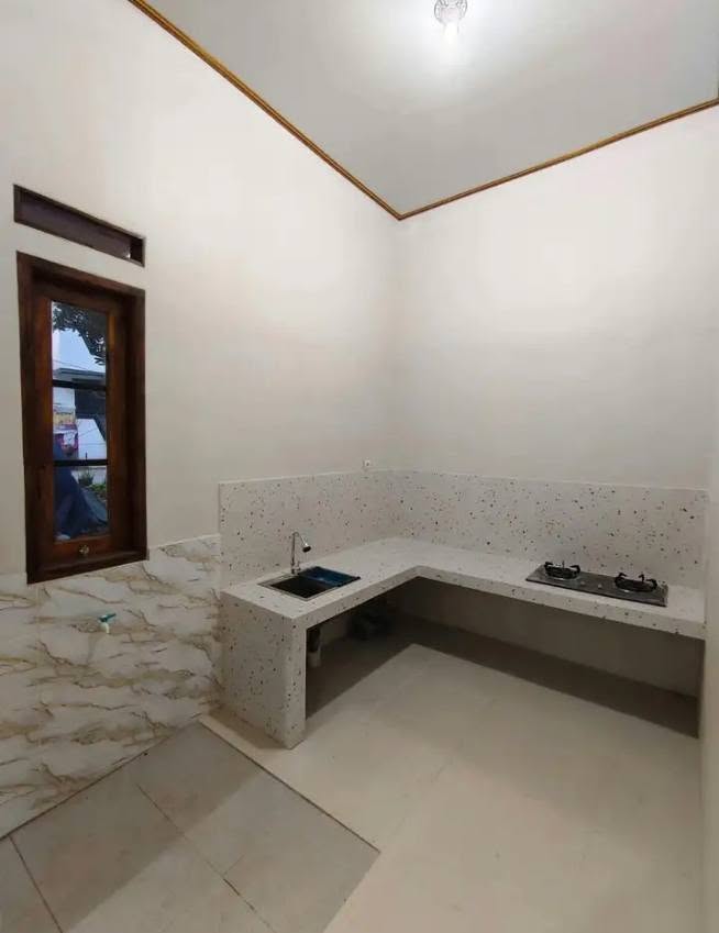 House for Sale in Graha Melasti, Bekasi with Garden and Carport 2